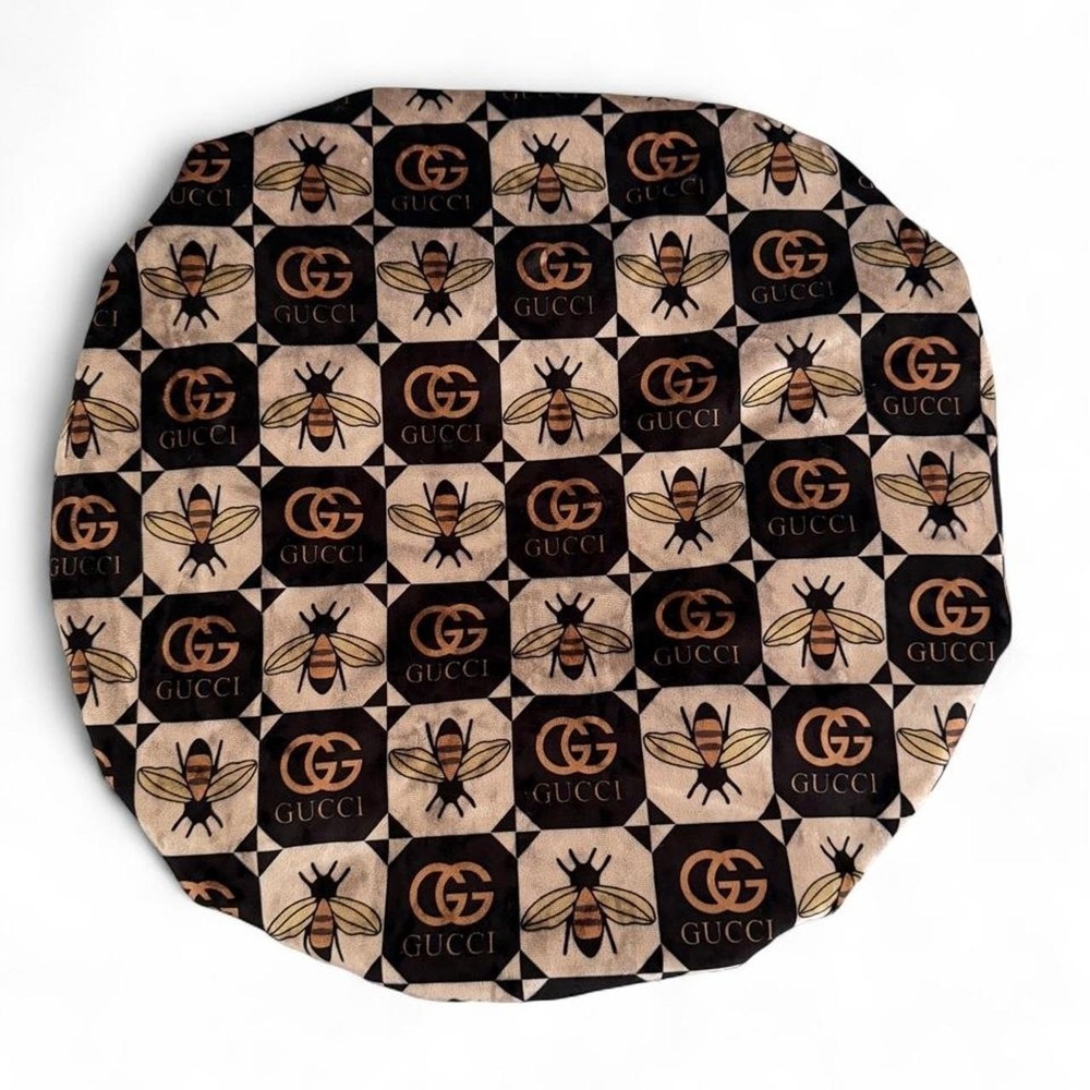 Handmade reversible satin sleep bonnet featuring a chic bee-inspired print